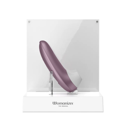 Womanizer Pro i lilla vist i original emballage, et diskret lufttryksvibrator-design til kvinder, der ønsker rolig og præcis stimulering.
