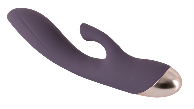 Javida vibrator i mørkelilla med buet form, fleksibel klitorisstimulator og gylden afslutning. Viser produktets elegante design og funktionelle opbygning til intens og målrettet stimulation.