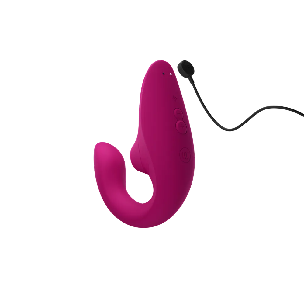 Womanizer Blend sexlegetøj i pink med magnetisk USB-opladningskabel. Produktbillede der viser lufttryksvibratorens genopladelige funktion og ergonomiske design til diskret og komfortabel stimulering.