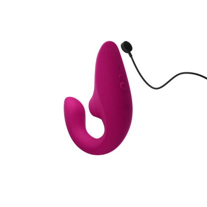 Womanizer Blend sexlegetøj i pink med magnetisk USB-opladningskabel. Produktbillede der viser lufttryksvibratorens genopladelige funktion og ergonomiske design til diskret og komfortabel stimulering.