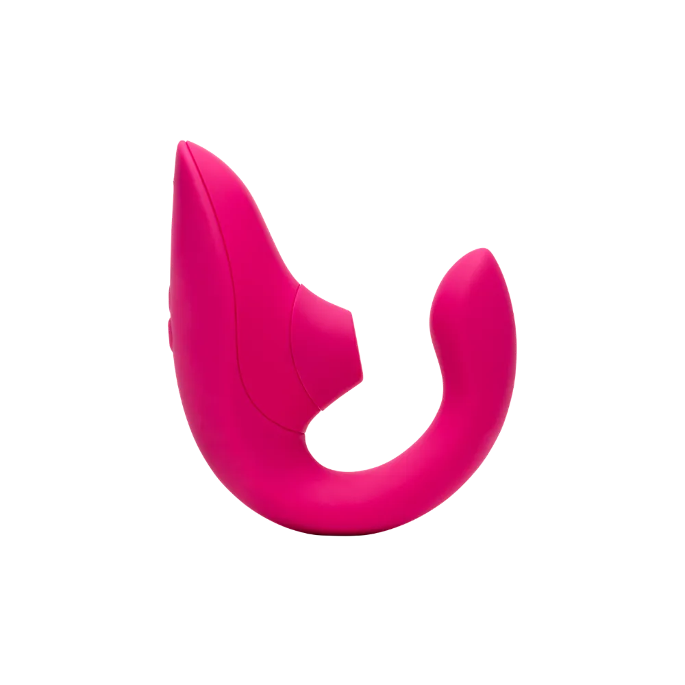 Sideprofil af Womanizer Blend sexlegetøj i pink. Produktbillede der fremhæver lufttryksvibratorens buede ergonomiske design og klitorisstimulator til præcis stimulering.