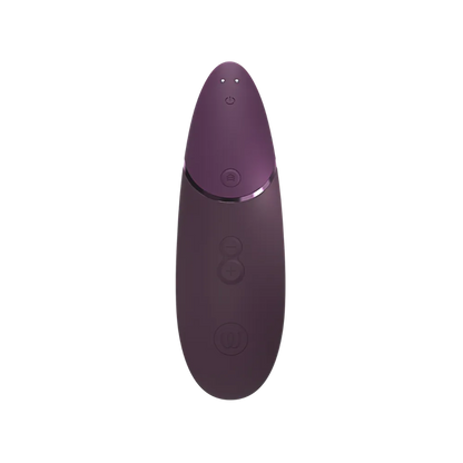 Womanizer Next i aubergine set ovenfra med power-knap, sensor og Climax Control-knapper. Kompakt og diskret design i luksuriøs auberginefarve.