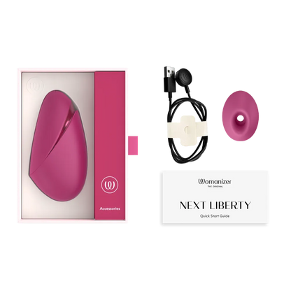 Womanizer Next Liberty i emballage med oplader, ekstra stimulationhead og vejledning