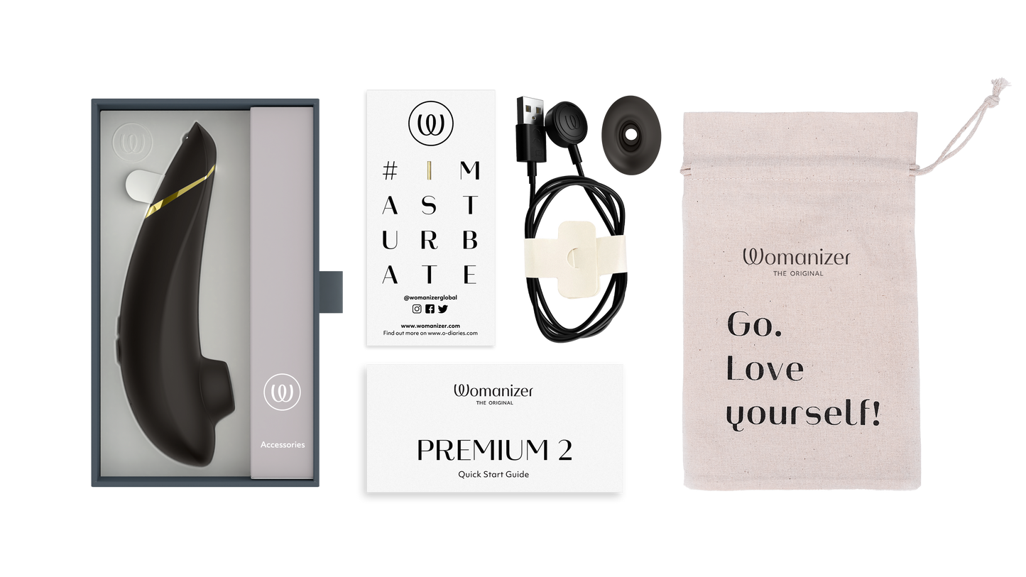 Womanizer Premium 2 i original æske med tilbehør, oplader, opbevaringspose og brugermanual – luksuriøst lufttryksprodukt til kvindelig nydelse.