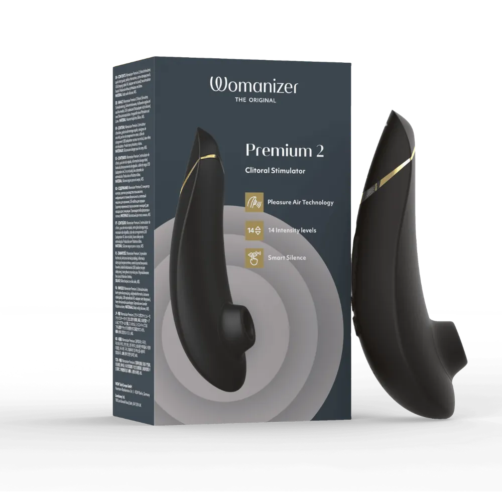 Womanizer Premium 2 i sort med gyldne detaljer vist i elegant gaveæske. Intimprodukt med lufttryksstimulation, 14 intensitetsniveauer og smart silence – diskret luksus til moderne kvinder.