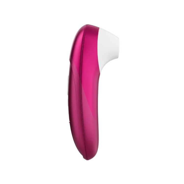 Womanizer Pro lufttryksvibrator i vibrant pink vist i sideprofil. Stilrent sexlegetøj til kvinder med Pleasure Air teknologi, ergonomisk greb og designet til diskret og effektiv klitorisstimulering.